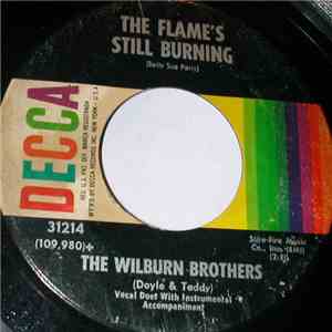 The Wilburn Brothers (Doyle & Teddy)) - The Flame's Still Burning / The Legend Of The Big River Train mp3 album