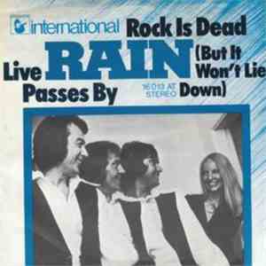 Rain  - Rock Is Dead (But I Won't Lie Down) / Live Passes By mp3 album